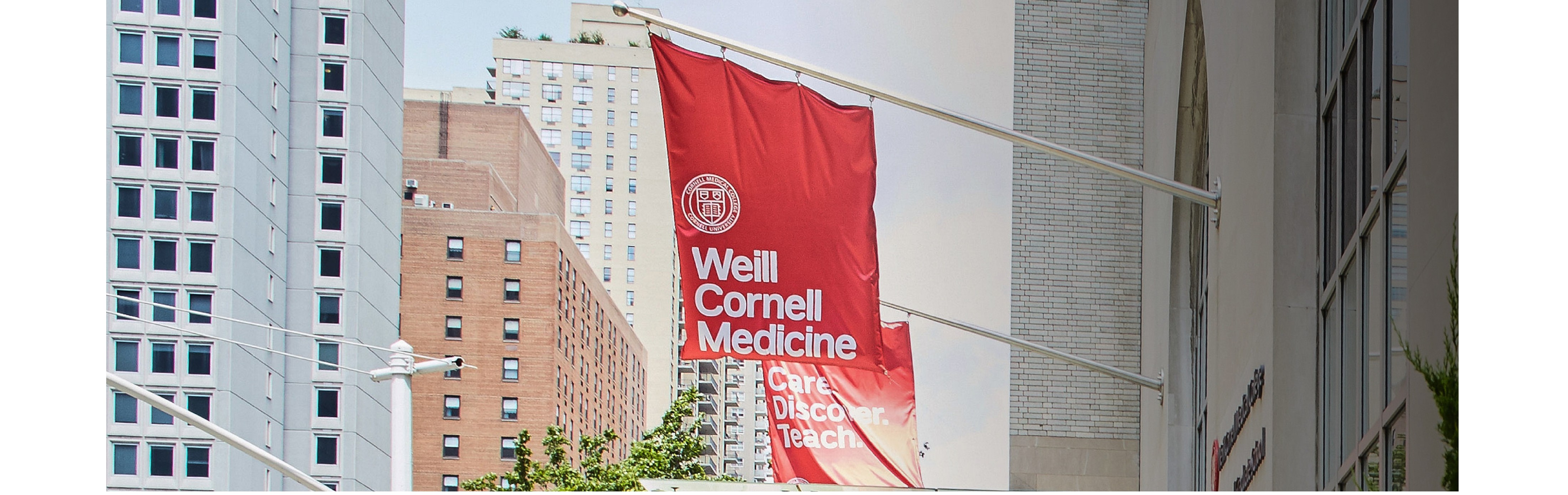 Weill Cornell Medicine Building with flags